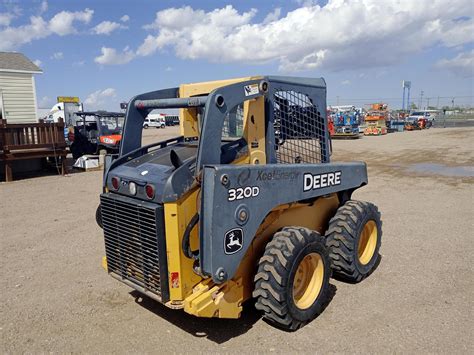 320d vs t-300 skid steer|deere 320d review.